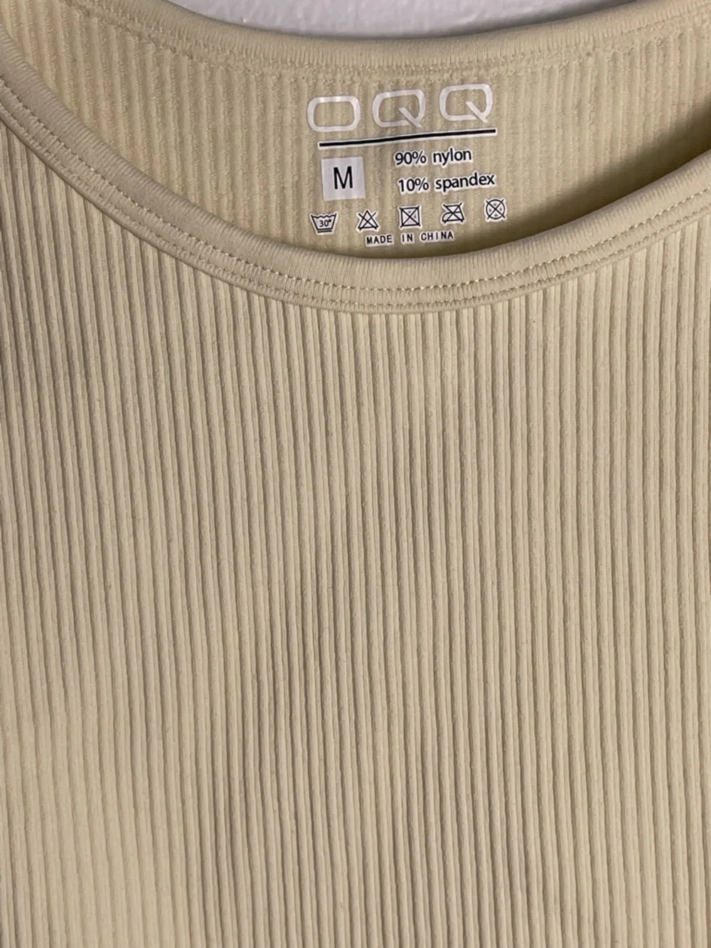 OQQ Women’s Sleeveless Cream Ribbed Bodysuit - Minimal Crew Neck Size M NWOT